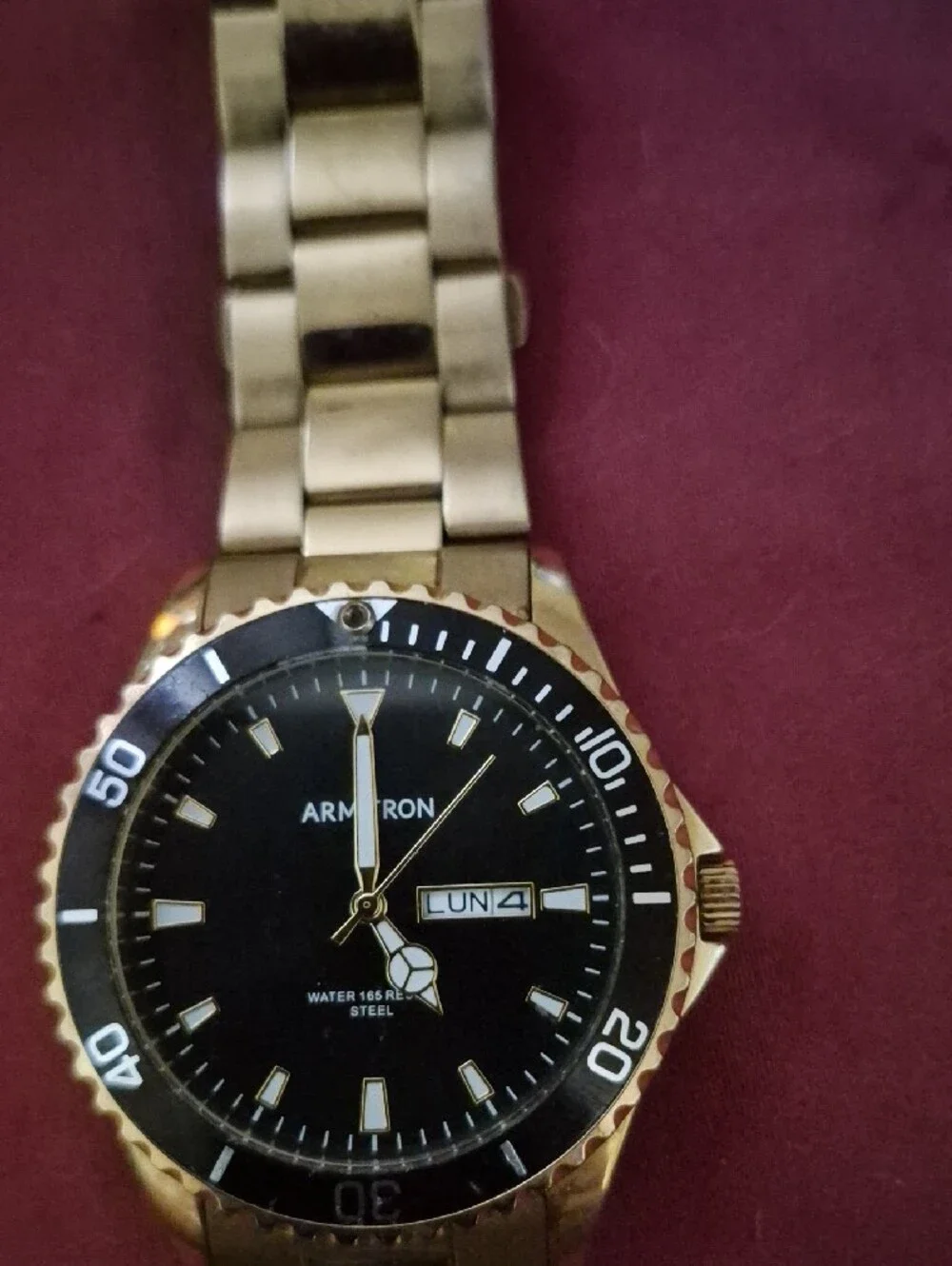 Armitron Gold-Tone Watch with Black Dial and Day-Date